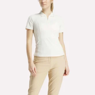Polo de golf ajustado con cremallera y manga corta para mujer