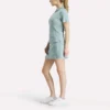 Polo de golf ajustado con cremallera y manga corta para mujer Polo de golf ajustado con cremallera y manga corta para mujer