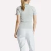 Polo de golf ajustado con cremallera y manga corta para mujer Polo de golf ajustado con cremallera y manga corta para mujer
