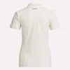 Polo de golf ajustado con cremallera y manga corta para mujer Polo de golf ajustado con cremallera y manga corta para mujer