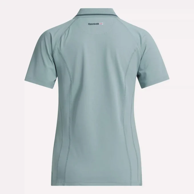 Polo de golf ajustado con cremallera y manga corta para mujer Polo de golf ajustado con cremallera y manga corta para mujer