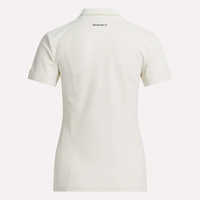 Polo de golf ajustado con cremallera y manga corta para mujer Polo de golf ajustado con cremallera y manga corta para mujer
