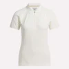 Polo de golf ajustado con cremallera y manga corta para mujer Polo de golf ajustado con cremallera y manga corta para mujer
