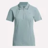Polo de golf ajustado con cremallera y manga corta para mujer Polo de golf ajustado con cremallera y manga corta para mujer
