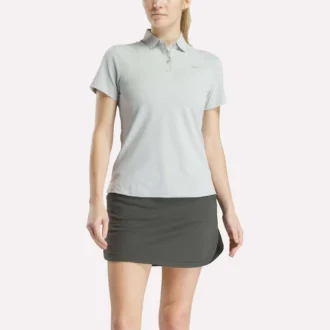 Polo de manga corta con tapeta de piqué elástico para mujer
