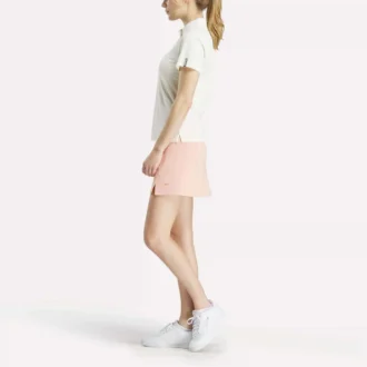 Polo de manga corta con tapeta de piqué elástico para mujer