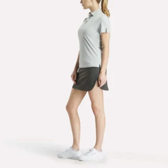 Polo de manga corta con tapeta de piqué elástico para mujer