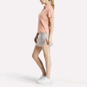 Polo de manga corta con tapeta de piqué elástico para mujer